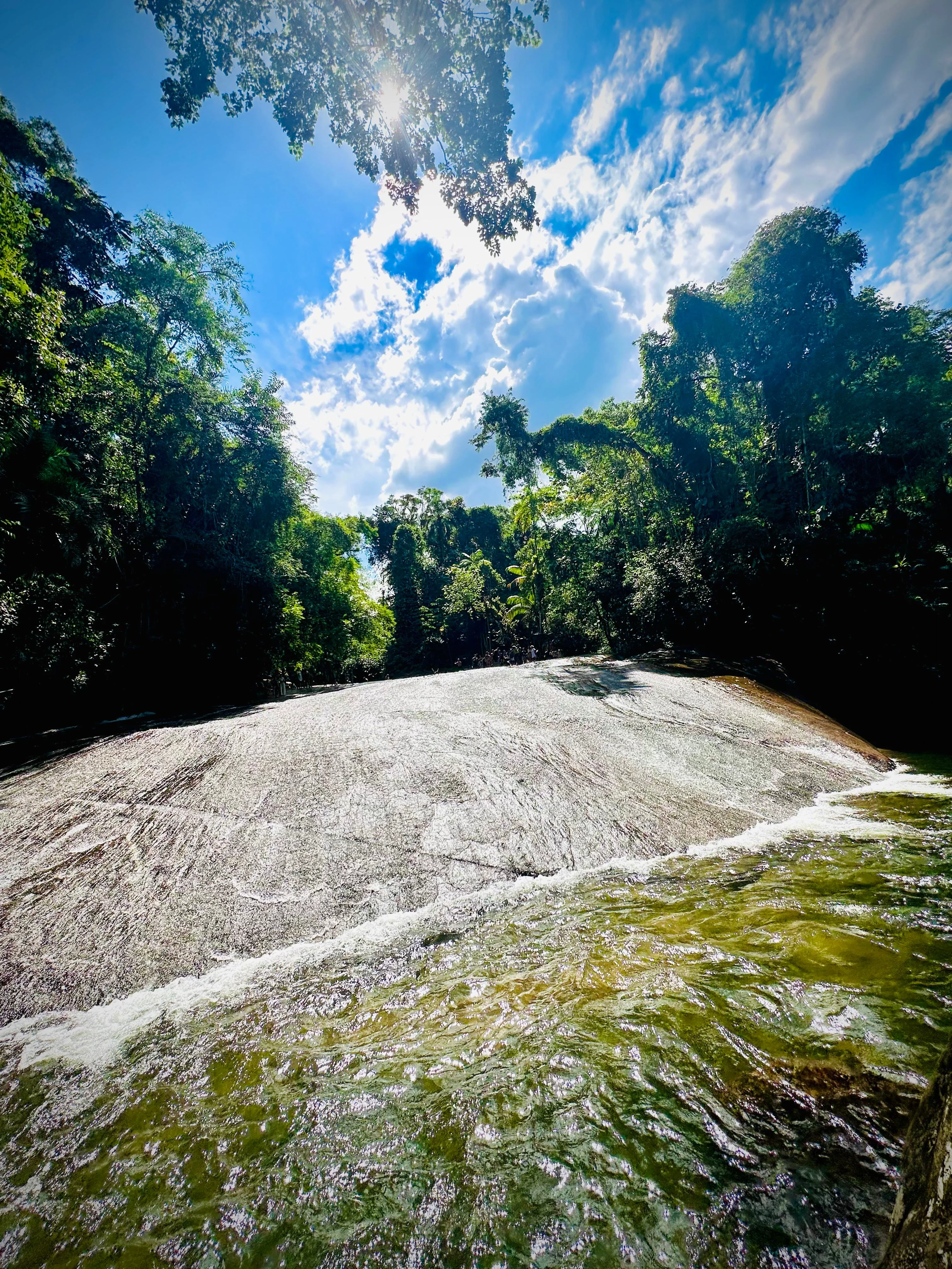 Sliding down Tobogã Waterfall is one of Paraty's most unforgettable experiences.